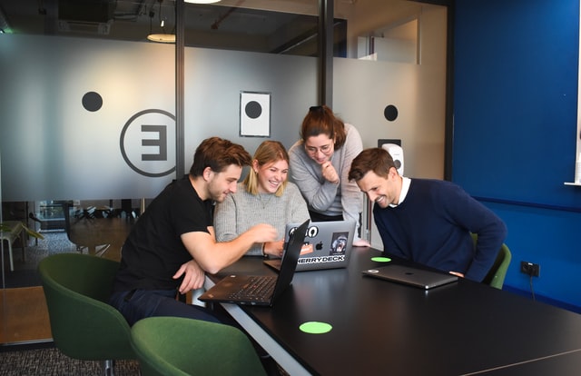 Team looking at laptop