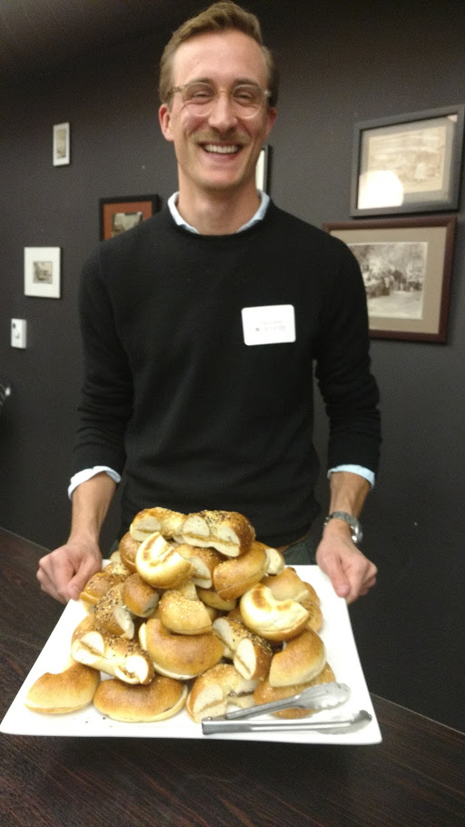 Frederic with a plate of bagels